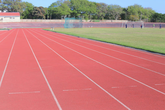 Synthetic running track with stadium seating